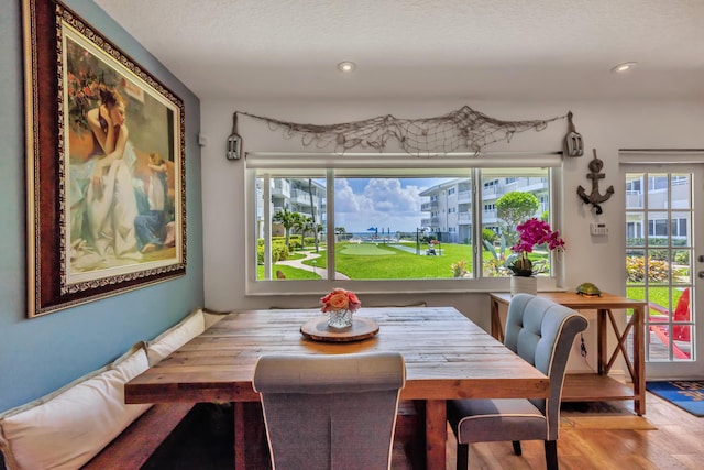 1199 Hillsboro Mile Unit 119, Hillsboro Beach, FL 33062 - dining area with recessed lighting, a textured ceiling, and wood finished floors