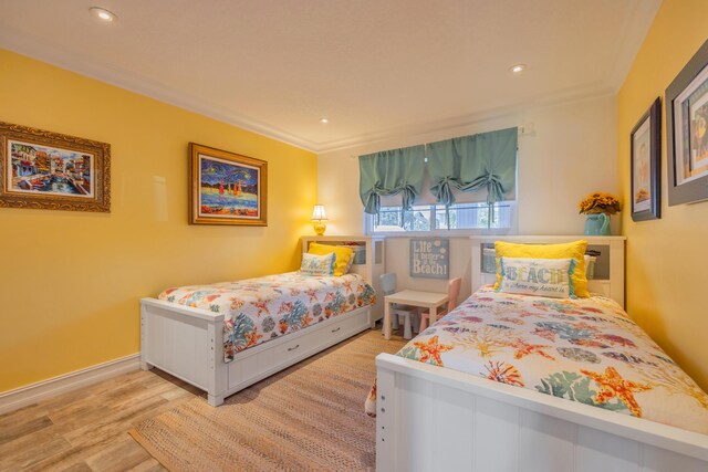 1199 Hillsboro Mile Unit 119, Hillsboro Beach, FL 33062 - bedroom featuring recessed lighting, ornamental molding, and wood finished floors