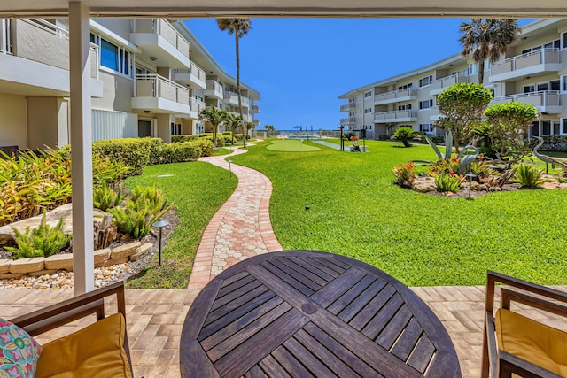1199 Hillsboro Mile Unit 119, Hillsboro Beach, FL 33062 - view of community with a lawn