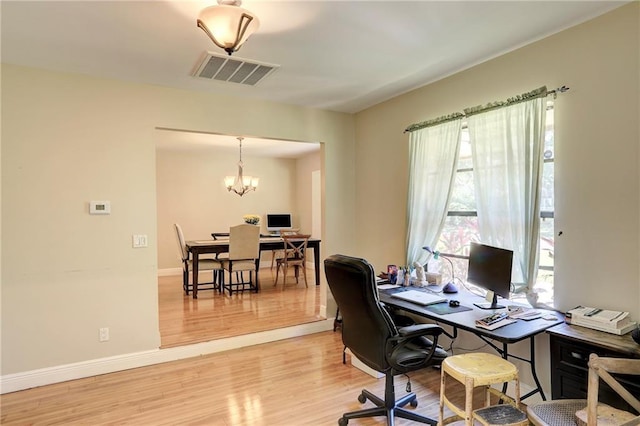 1090 31st Ave, Vero Beach, FL 32960 - office with baseboards, visible vents, light wood-style floors, and an inviting chandelier