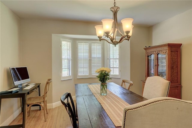 1090 31st Ave, Vero Beach, FL 32960 - dining room featuring an inviting chandelier, baseboards, and wood finished floors