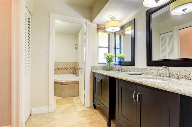 1090 31st Ave, Vero Beach, FL 32960 - full bathroom with double vanity, a sink, a closet, and a garden tub