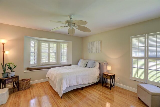 1090 31st Ave, Vero Beach, FL 32960 - bedroom featuring baseboards, multiple windows, and light wood-type flooring