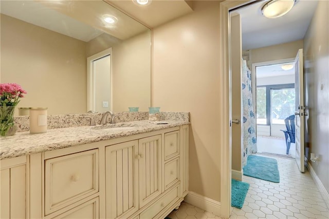 1090 31st Ave, Vero Beach, FL 32960 - full bathroom featuring baseboards, curtained shower, tile patterned flooring, and vanity