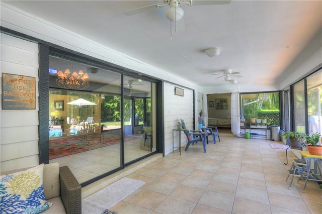1090 31st Ave, Vero Beach, FL 32960 - sunroom featuring ceiling fan and a healthy amount of sunlight