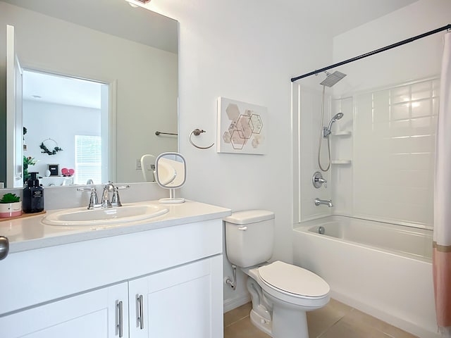 bathroom featuring tile patterned floors, shower / bath combo, vanity, and toilet