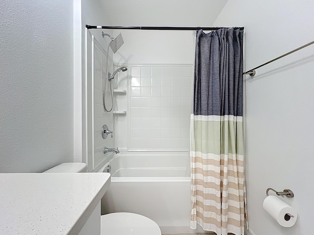 bathroom featuring shower / bath combination with curtain, toilet, and vanity
