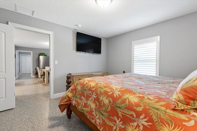 1200 Hartman Rd, Fort Pierce, FL 34947 - bedroom featuring baseboards and a textured ceiling