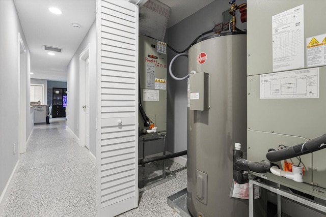 1200 Hartman Rd, Fort Pierce, FL 34947 - utility room featuring water heater and heating unit