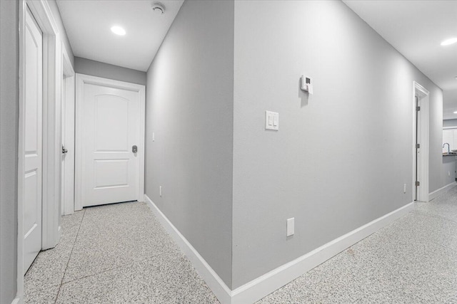 1200 Hartman Rd, Fort Pierce, FL 34947 - hall with baseboards, dark aggregate flooring, and recessed lighting