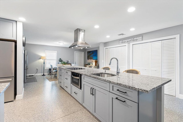 1200 Hartman Rd, Fort Pierce, FL 34947 - kitchen with stainless steel appliances, island range hood, a sink, baseboards, and dark aggregate flooring