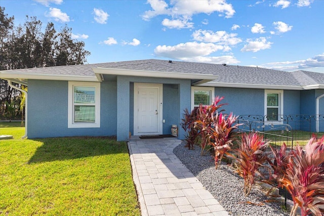 1200 Hartman Rd, Fort Pierce, FL 34947 - ranch-style home with stucco siding and a shingled roof