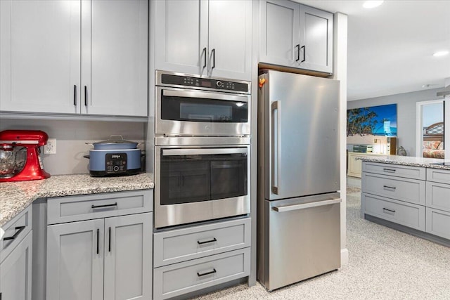 1200 Hartman Rd, Fort Pierce, FL 34947 - kitchen featuring appliances with stainless steel finishes, gray cabinetry, light stone countertops, and recessed lighting