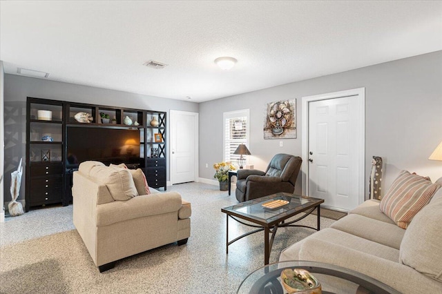 1200 Hartman Rd, Fort Pierce, FL 34947 - living room featuring baseboards and speckle patterned floor