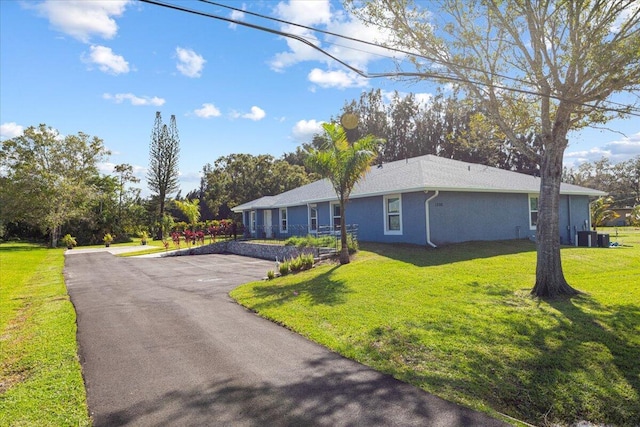 1200 Hartman Rd, Fort Pierce, FL 34947 - ranch-style home with a front yard