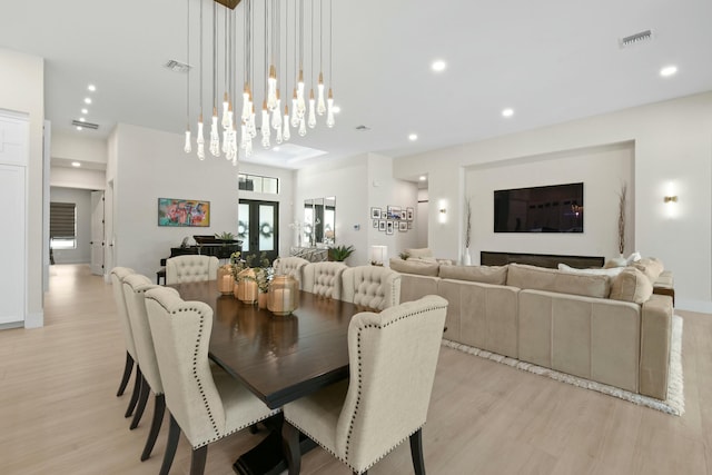 dining area with recessed lighting, light wood-type flooring, and visible vents