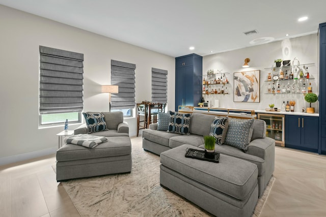 living room with a bar, beverage cooler, baseboards, visible vents, and recessed lighting