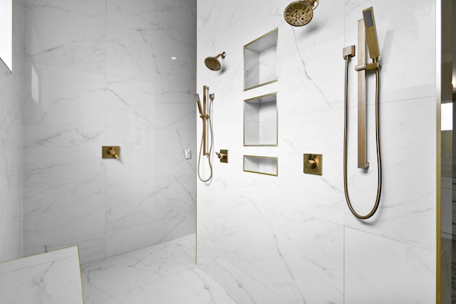 bathroom with a marble finish shower