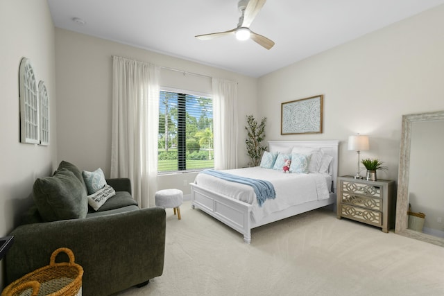 bedroom featuring light colored carpet and ceiling fan