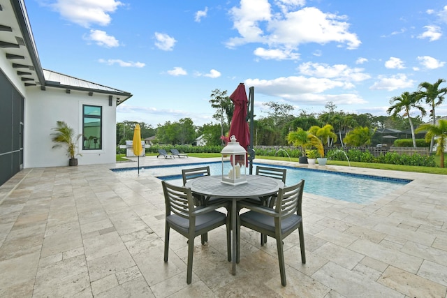 view of patio / terrace featuring fence and a fenced in pool