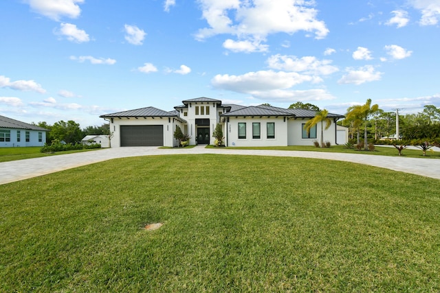 prairie-style home featuring a front lawn, stucco siding, a standing seam roof, decorative driveway, and metal roof