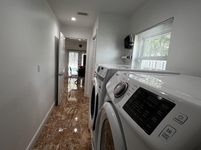 laundry area with separate washer and dryer, baseboards, dark marble finish flooring, and recessed lighting