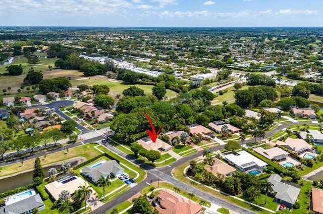 aerial view of property and surrounding area featuring nearby suburban area