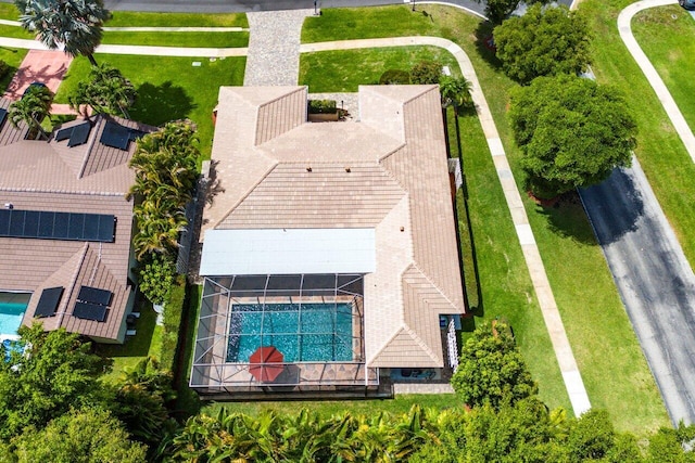 view of subject property with a pool
