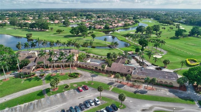 view of property location featuring a large body of water and a local golf course