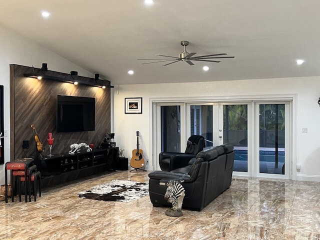 living area with french doors, recessed lighting, ceiling fan, marble finish flooring, and lofted ceiling