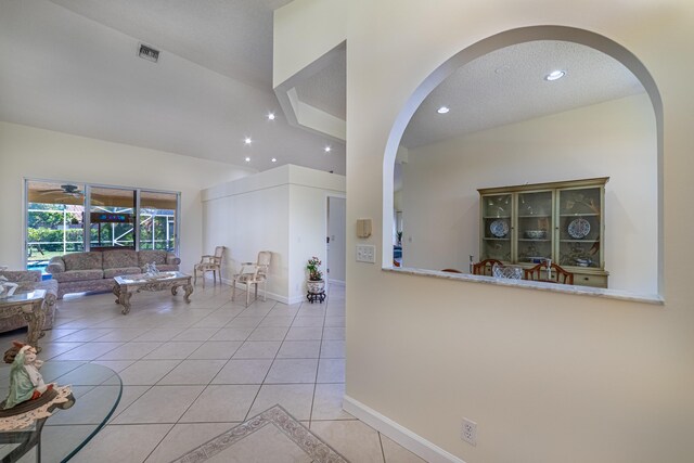 22234 Collington Dr, Boca Raton, FL 33428 - living area featuring light tile patterned floors, arched walkways, recessed lighting, a ceiling fan, and baseboards