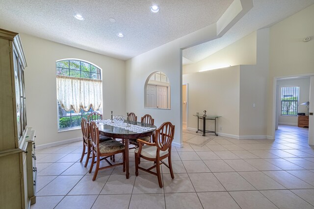 22234 Collington Dr, Boca Raton, FL 33428 - dining room with a textured ceiling, recessed lighting, light tile patterned floors, and baseboards