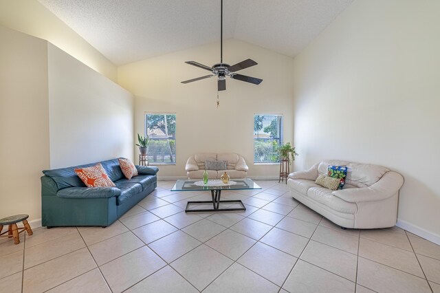 22234 Collington Dr, Boca Raton, FL 33428 - living room featuring light tile patterned flooring, baseboards, high vaulted ceiling, and ceiling fan
