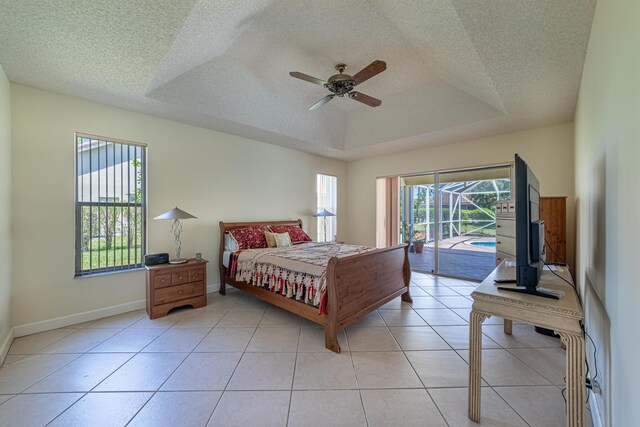 22234 Collington Dr, Boca Raton, FL 33428 - bedroom with access to outside, a textured ceiling, a tray ceiling, a ceiling fan, and baseboards