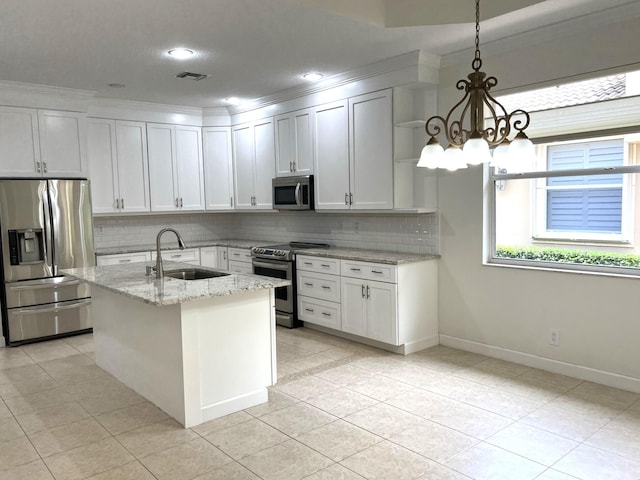 7032 Willow Pine Way, Port Saint Lucie, FL 34986 - kitchen featuring appliances with stainless steel finishes, a sink, a chandelier, tasteful backsplash, and light tile patterned floors