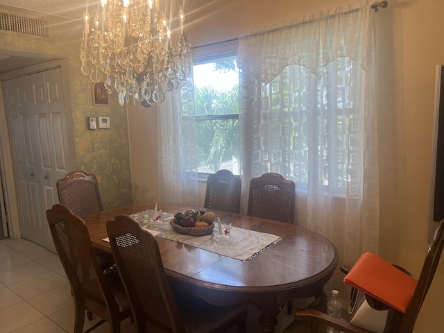 75 Flanders B B, Delray Beach, FL 33484 - dining room featuring light tile patterned flooring, visible vents, and an inviting chandelier