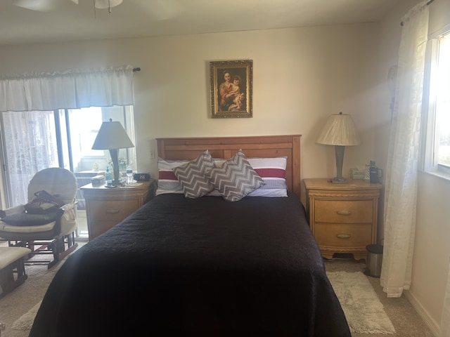 75 Flanders B B, Delray Beach, FL 33484 - bedroom featuring baseboards, multiple windows, and light colored carpet