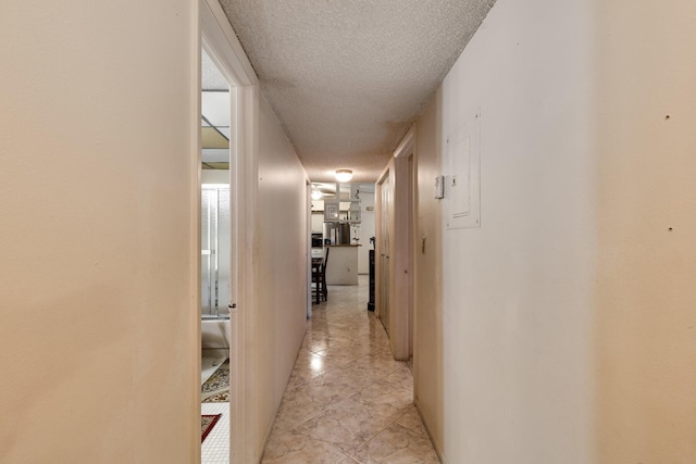 7612 Ashmont Cir Unit 203, Tamarac, FL 33321 - hallway with a textured ceiling and light tile patterned flooring