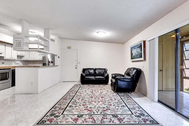 7612 Ashmont Cir Unit 203, Tamarac, FL 33321 - living room featuring a textured ceiling