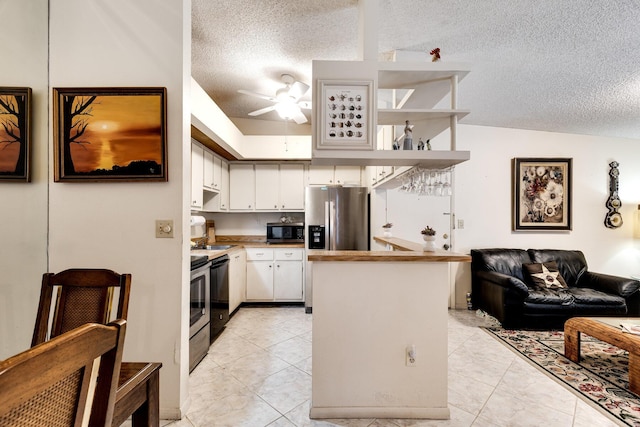 7612 Ashmont Cir Unit 203, Tamarac, FL 33321 - kitchen with stainless steel appliances, a textured ceiling, a ceiling fan, white cabinets, and open floor plan