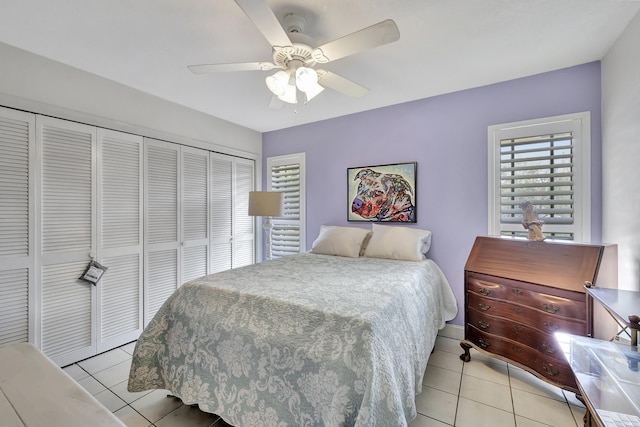 2211 NE 34th Ct, Lighthouse Point, FL 33064 - bedroom with a ceiling fan, a closet, and light tile patterned flooring