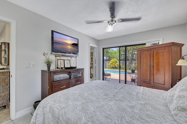 2211 NE 34th Ct, Lighthouse Point, FL 33064 - bedroom with access to outside, baseboards, light tile patterned floors, and a textured ceiling