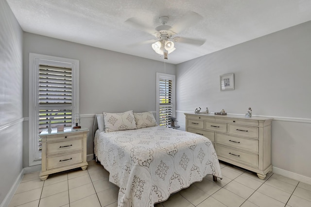 2211 NE 34th Ct, Lighthouse Point, FL 33064 - bedroom featuring baseboards, ceiling fan, and light tile patterned flooring