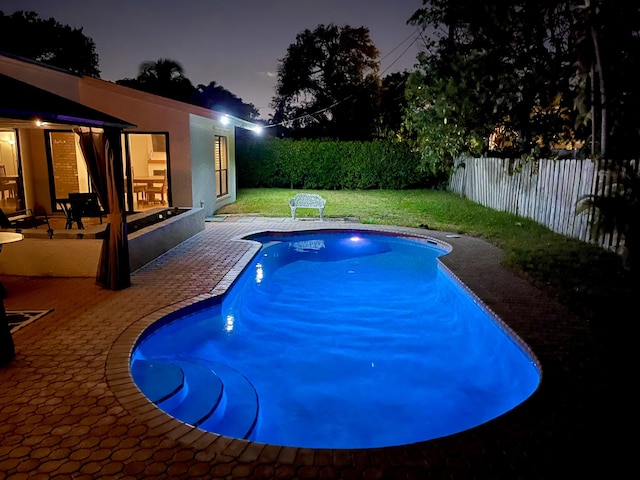 2211 NE 34th Ct, Lighthouse Point, FL 33064 - view of swimming pool with a lawn, a fenced in pool, a fenced backyard, and a patio area