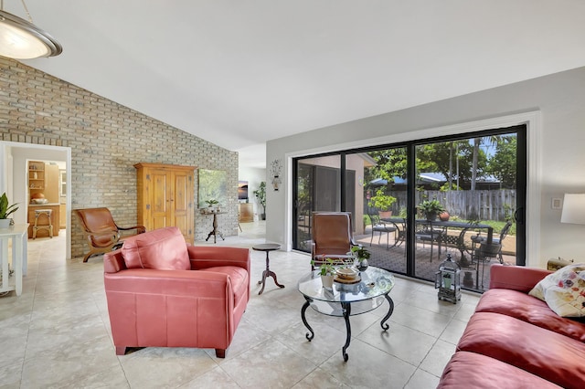 2211 NE 34th Ct, Lighthouse Point, FL 33064 - living room with light tile patterned floors, high vaulted ceiling, and brick wall