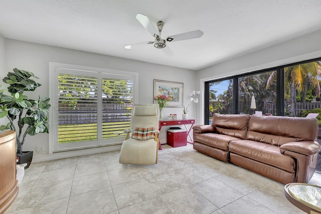 2211 NE 34th Ct, Lighthouse Point, FL 33064 - living room featuring light tile patterned floors and a ceiling fan