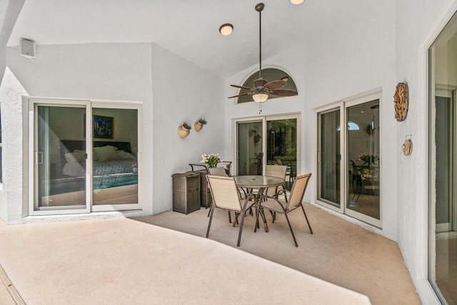 view of patio with a ceiling fan and outdoor dining area