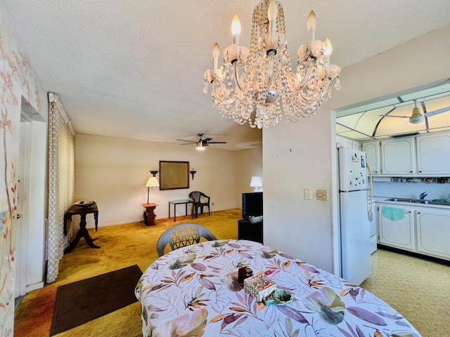 66 Andover C, West Palm Beach, FL 33417 - bedroom featuring light carpet, freestanding refrigerator, a chandelier, a textured ceiling, and a sink