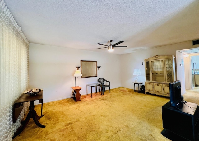 66 Andover C, West Palm Beach, FL 33417 - carpeted living area with ceiling fan, a textured ceiling, and baseboards