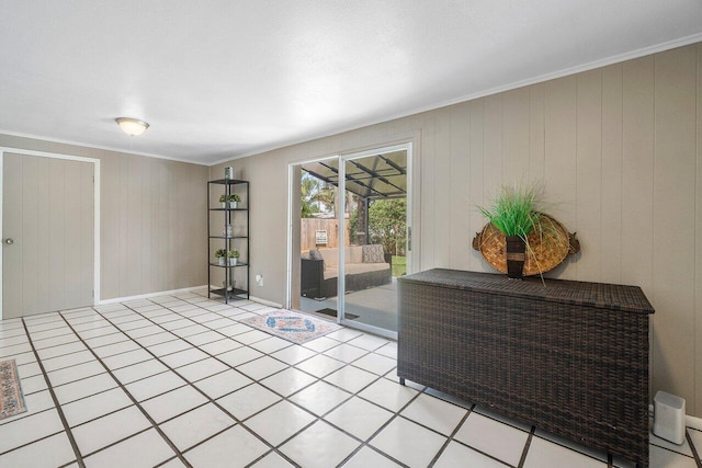 empty room with ornamental molding and baseboards